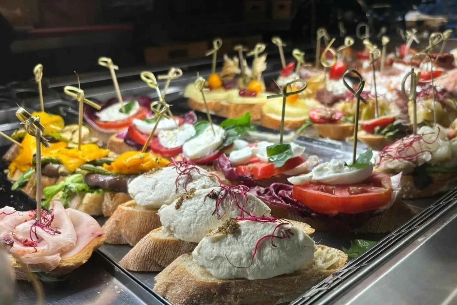 Traditional Venetian cicchetti appetizers served in a Verona wine bar